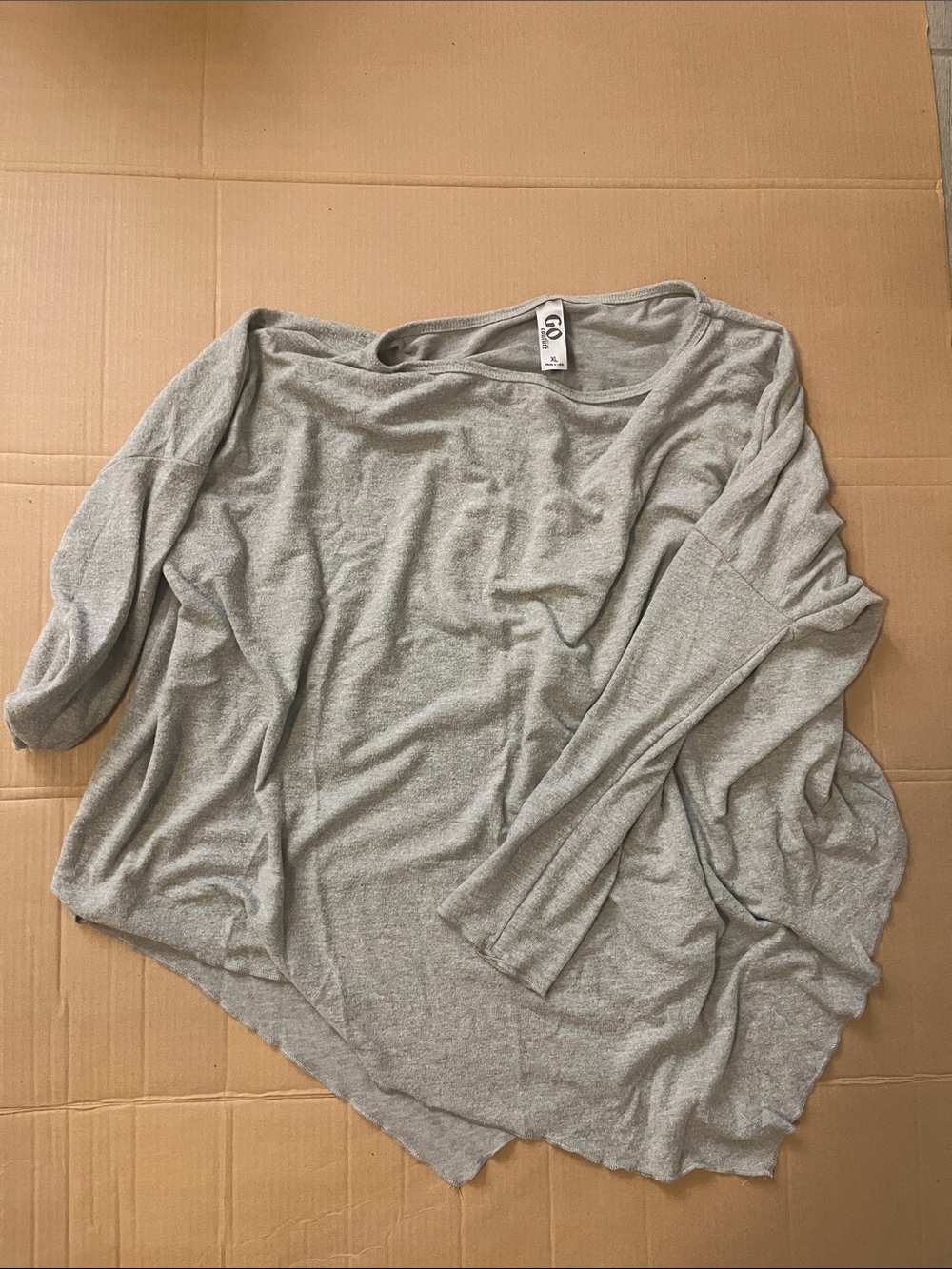 Go long sleeved slanted bottom tunic shirt
